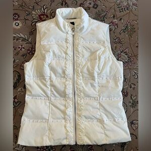 Gently worn women’s White House Black Market quilted ivory vest size Medium